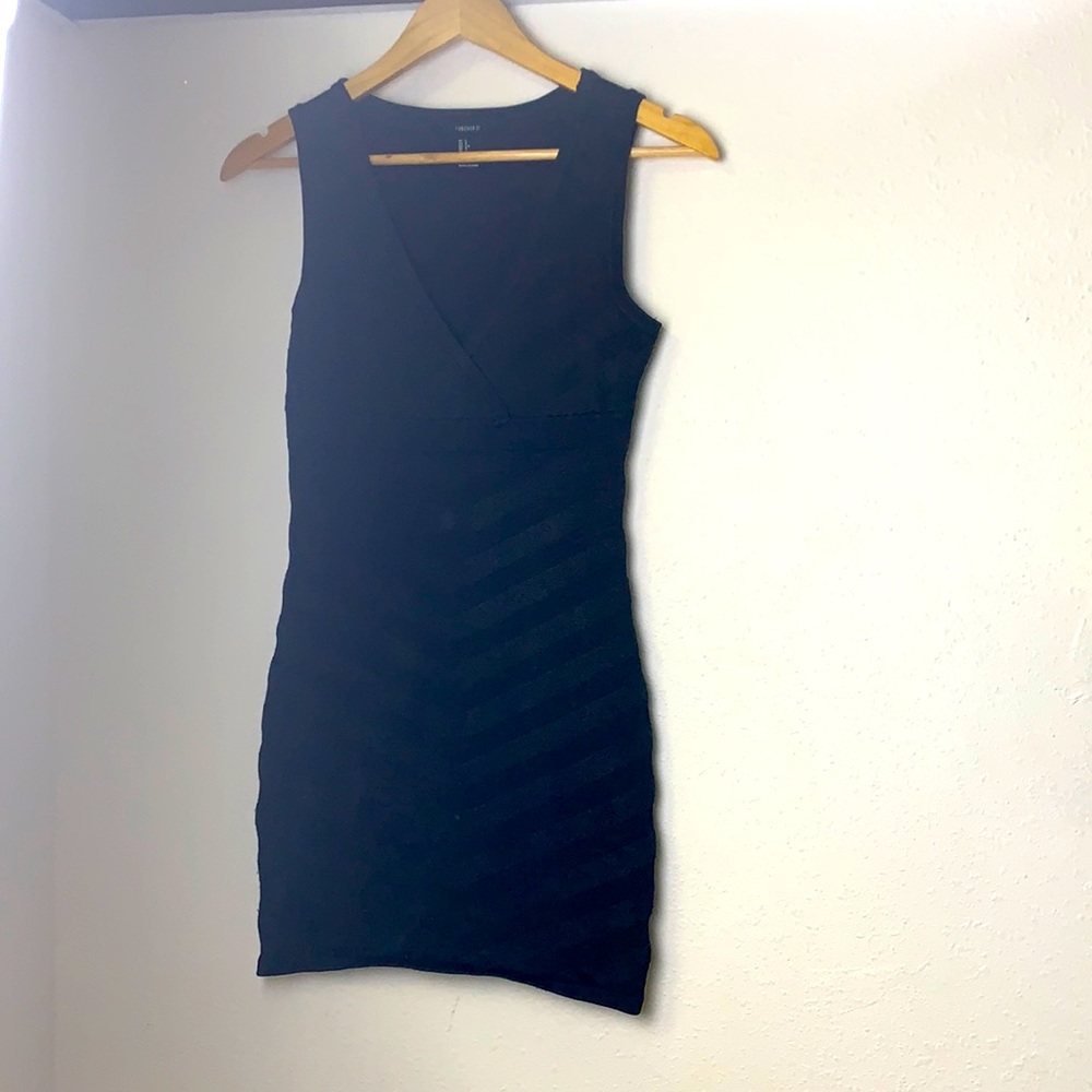 Black fitted dress with v-neckline & empire waist
